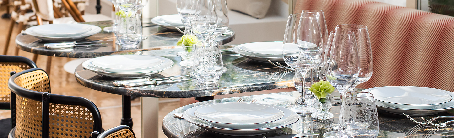 Marble tables and Thonet-style chairs at Villa Dorothea.
