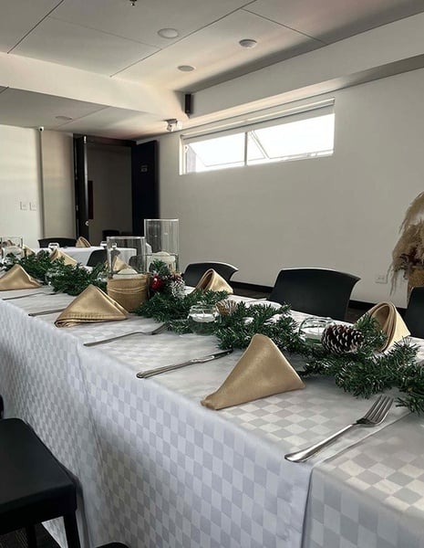 a white router with a blue wifi symbol on it