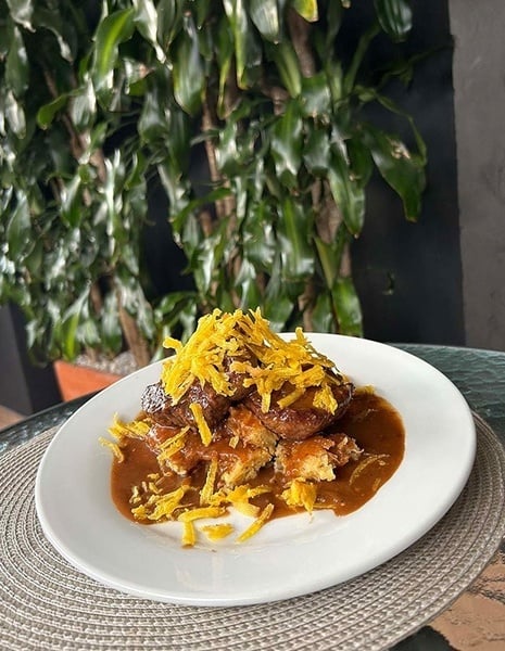 a white router with a blue wifi symbol on it