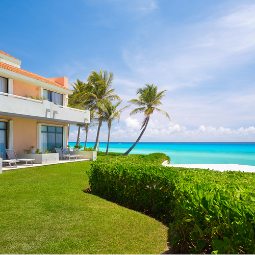 a house with a balcony overlooking the ocean