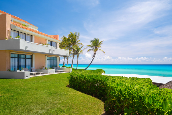 a house with a balcony overlooking the ocean