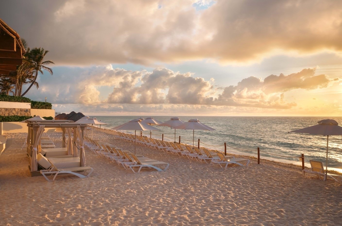 a restaurant table with a view of the ocean