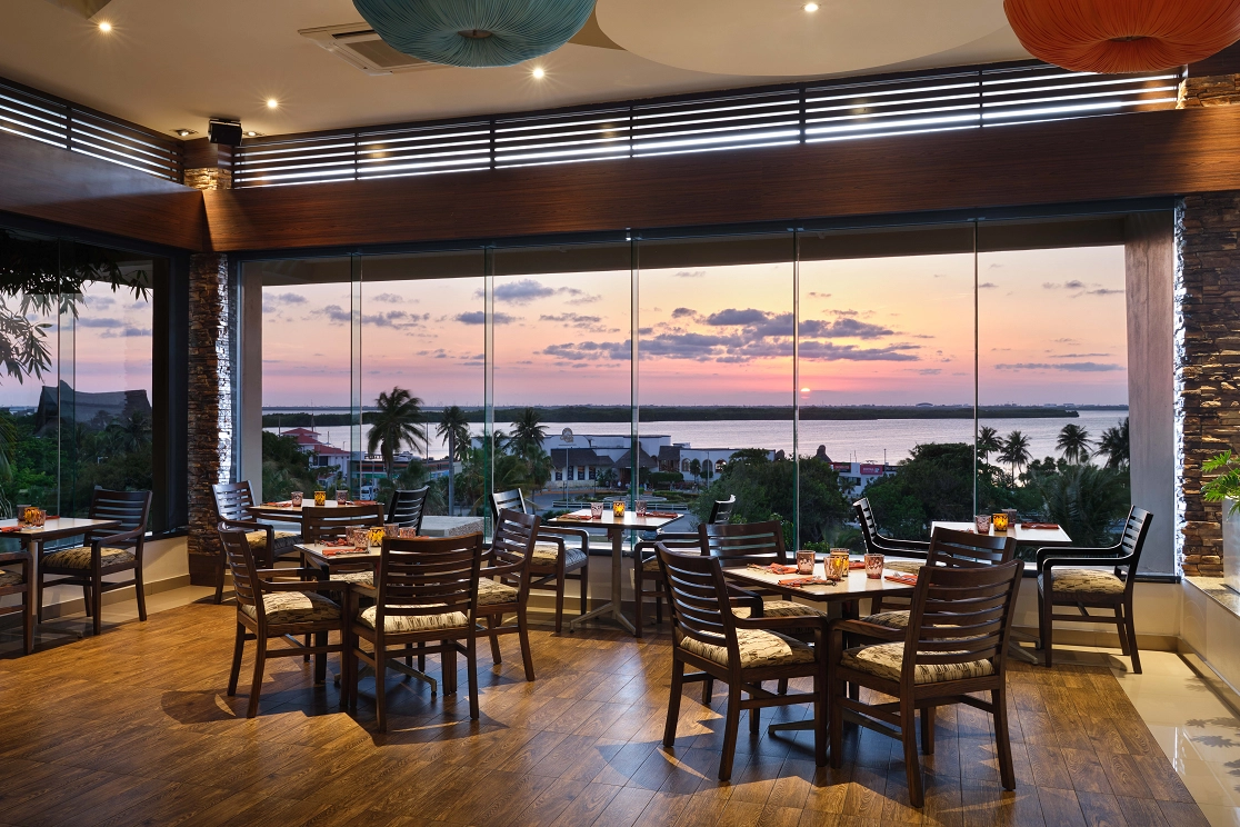 La Vista poolside restaurant at Wyndham Grand Cancun Resort & Villas featuring international buffet with lagoon views in Cancun