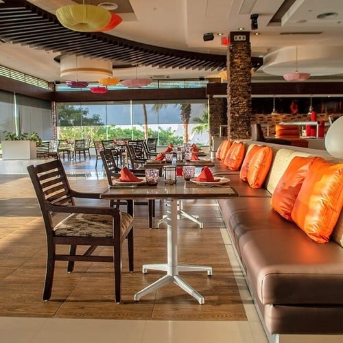 a restaurant with tables and chairs and a sign that says 00