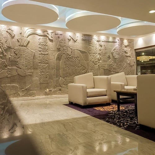 a room with a mural on the wall that says ' mexico ' on it