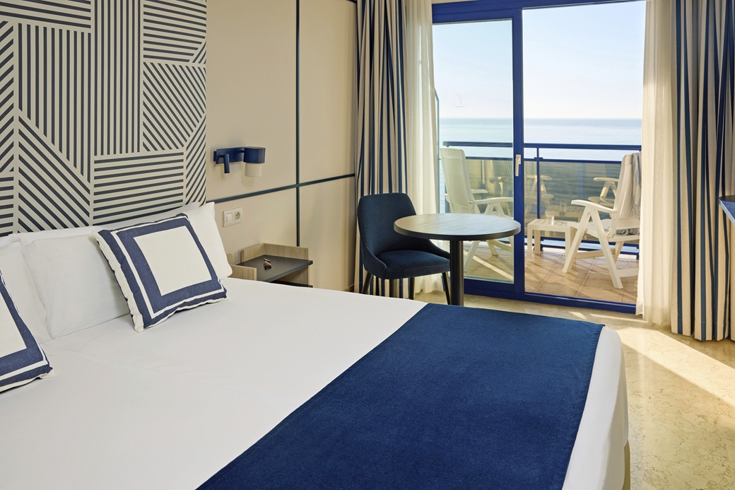 Yaramar hotel room with twin beds, modern design, and balcony.