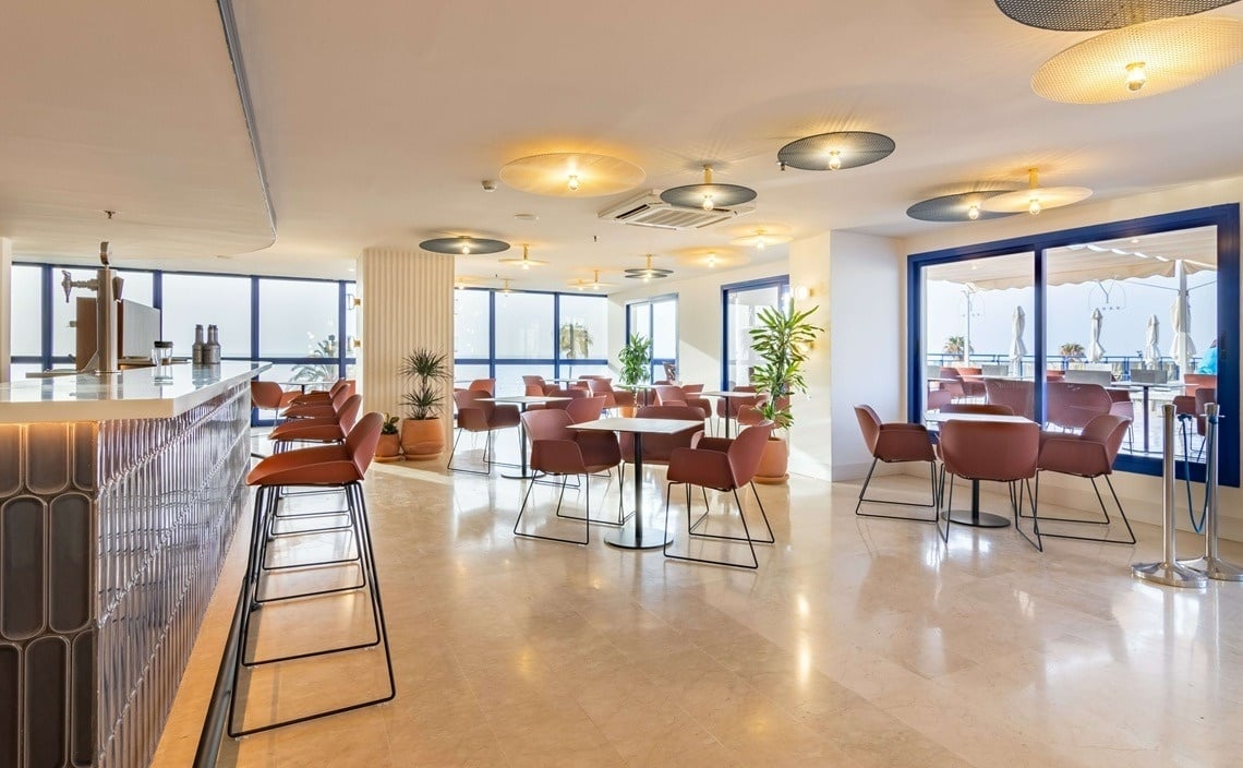 tables and chairs on a patio with a sign that says ' a ' on it