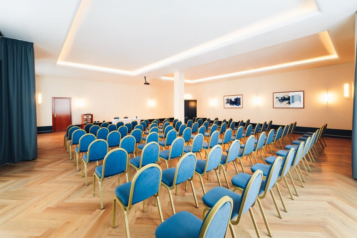 Blue chairs in a hotel conference room, perfect for Yaramar and meetings.