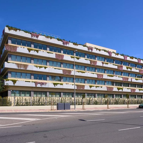 Modern hotel with green terraces in Ybarra Sevilla, Spain.