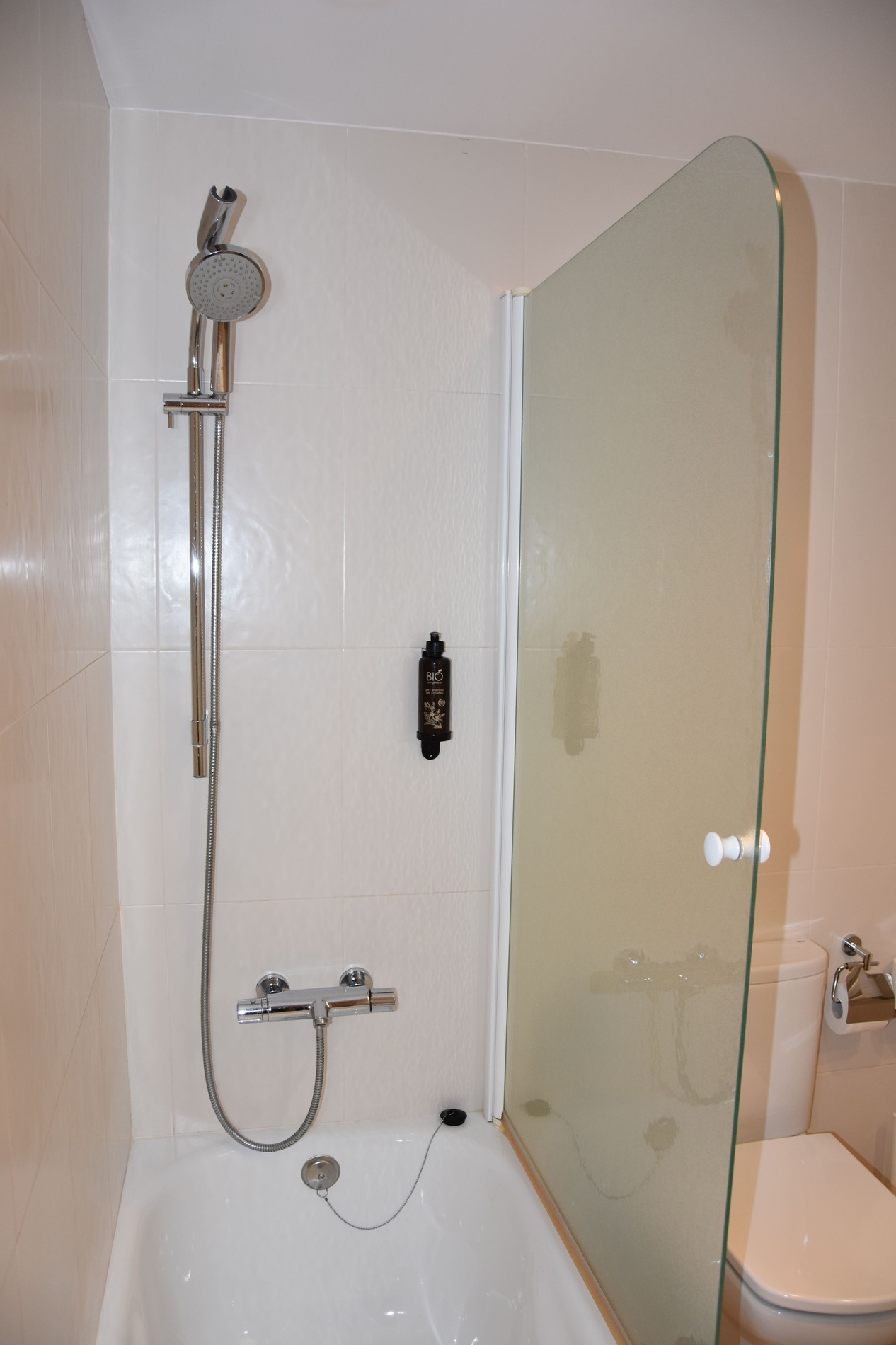 a bathroom with a sink a mirror and a towel rack