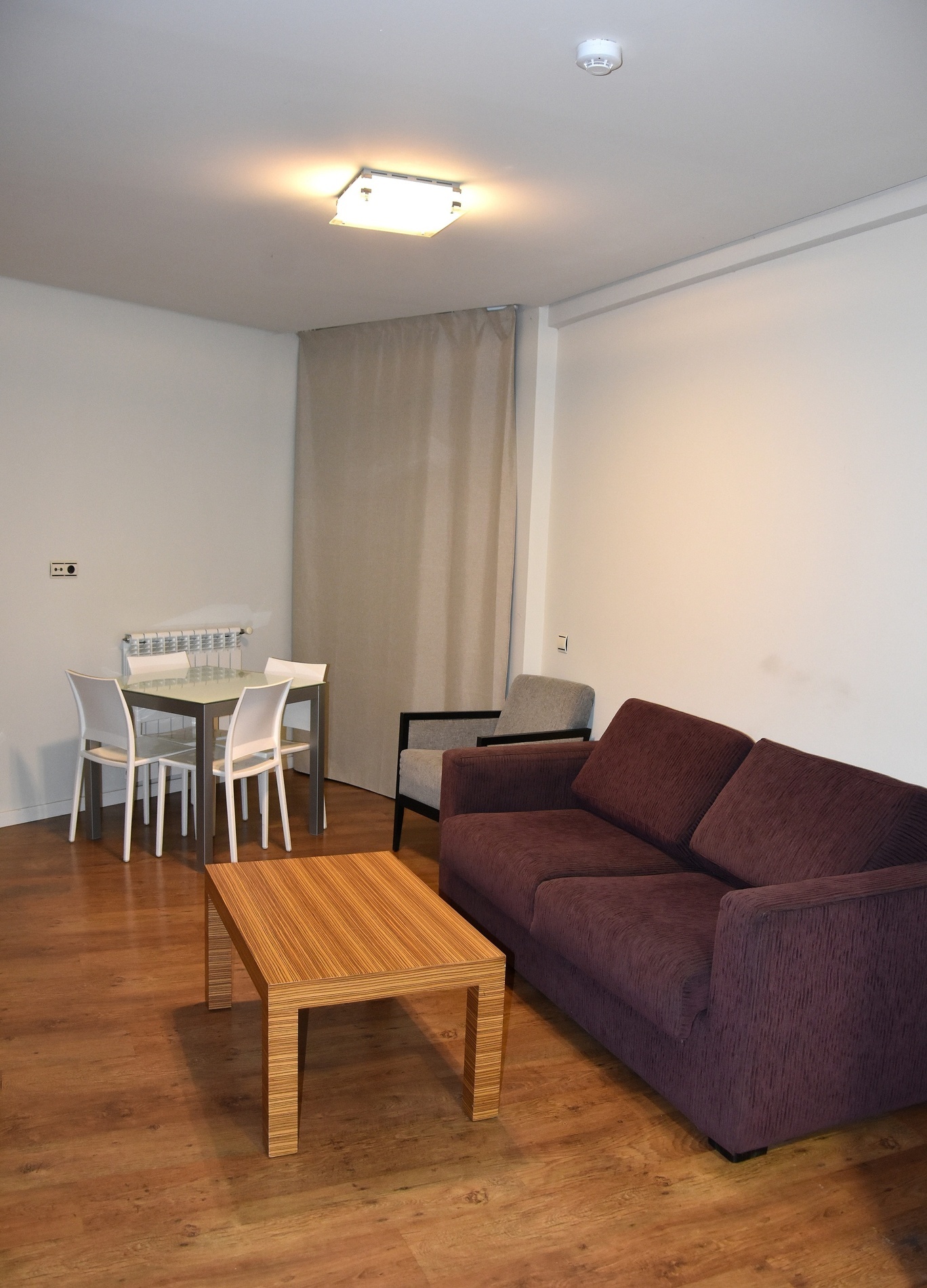 a living room with a couch a table and chairs