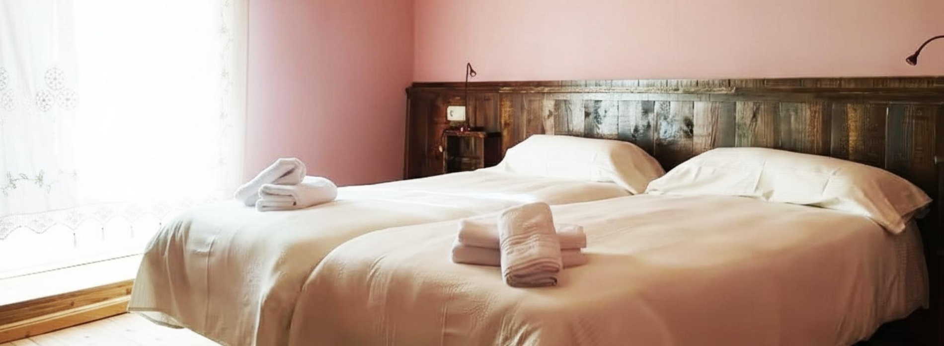 a bedroom with wood paneling and a single bed