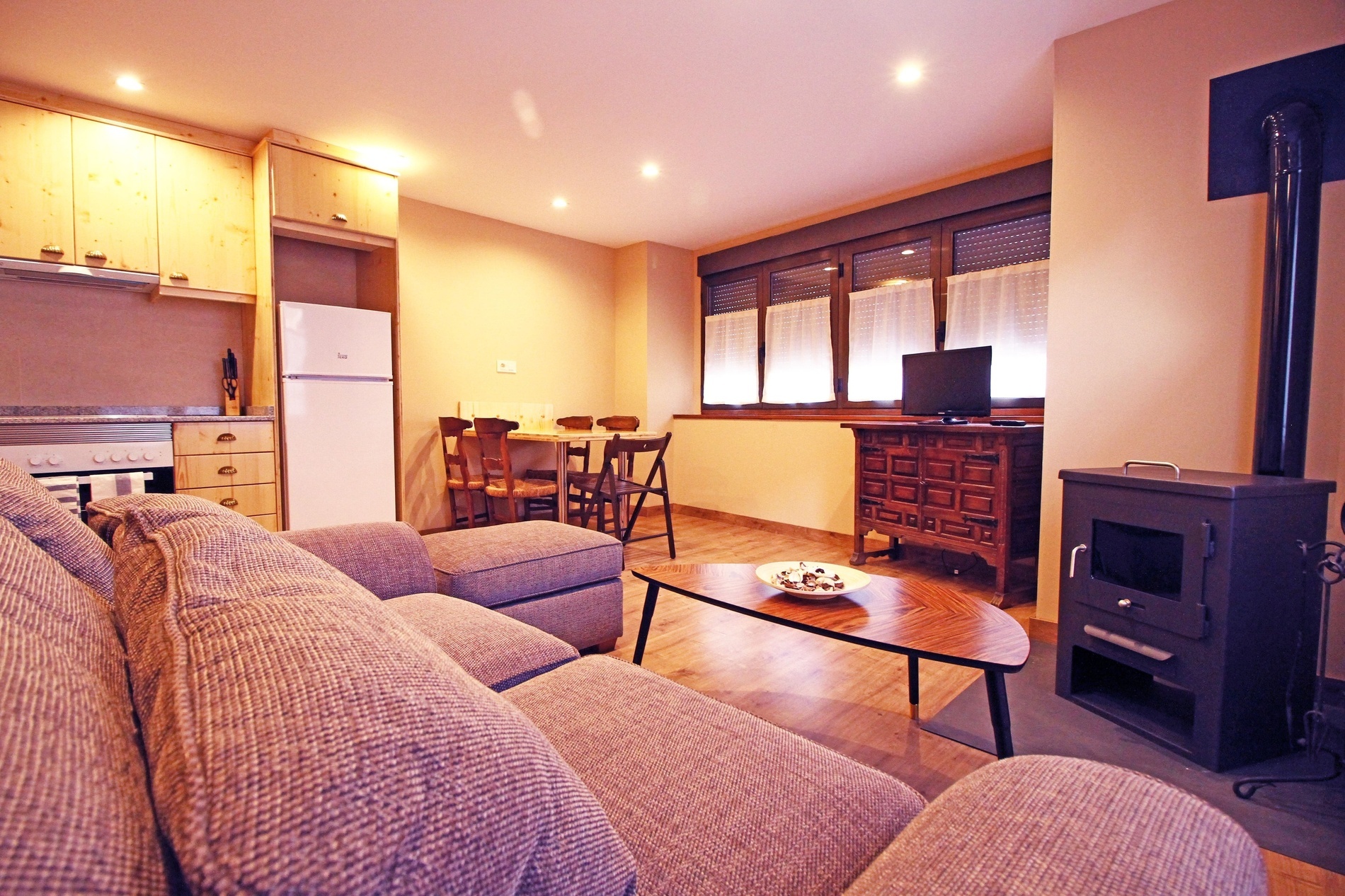 a living room with a picture of a bear on the wall