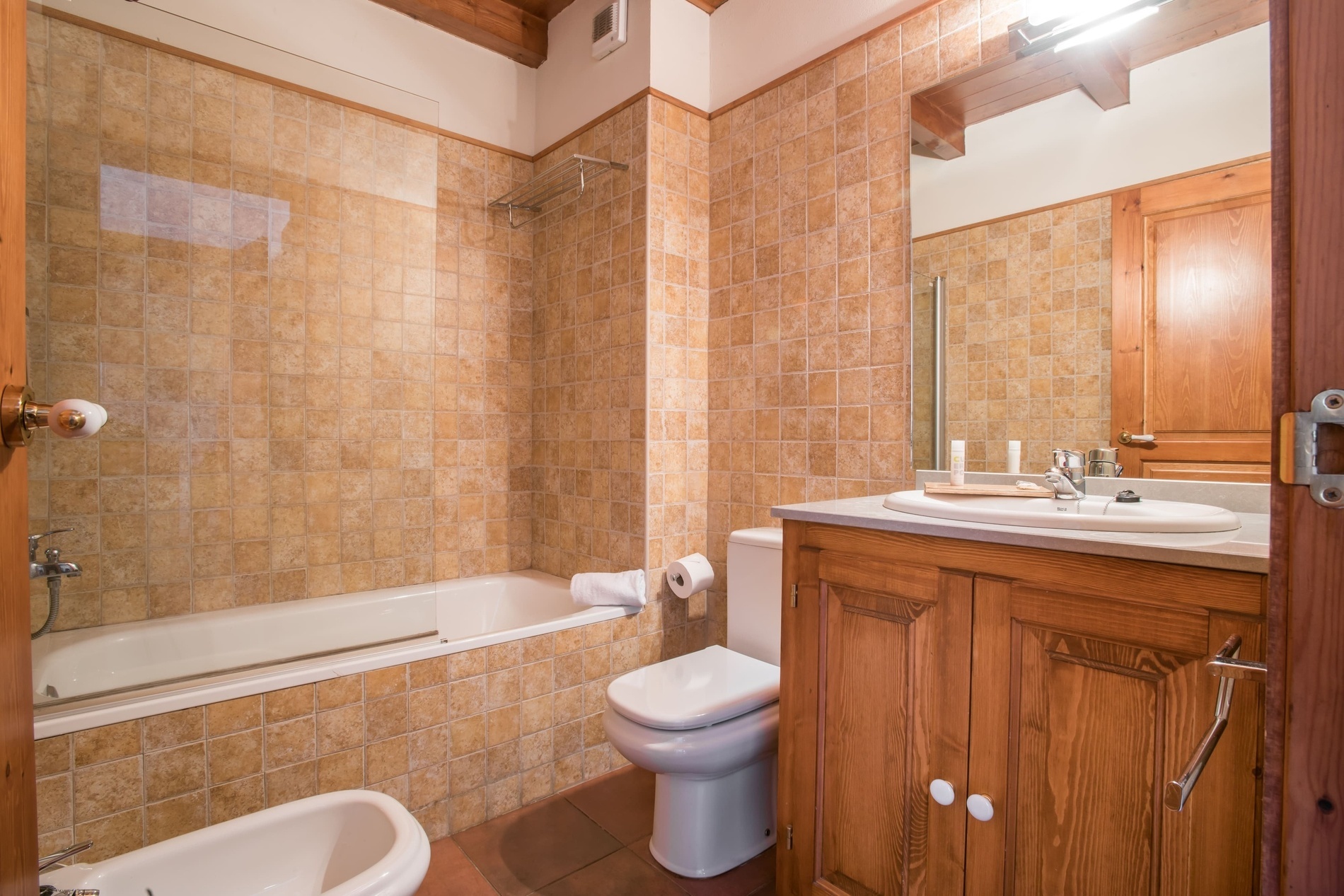 a bathroom with a toilet a sink and a bathtub