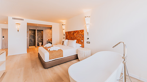 Modern room at Qhotels: Zahara Beach & SPA with sea view and balcony.
