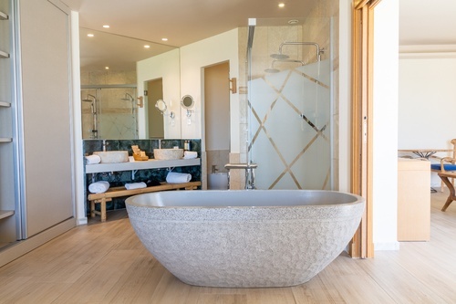 a bathroom with two sinks and a bathtub