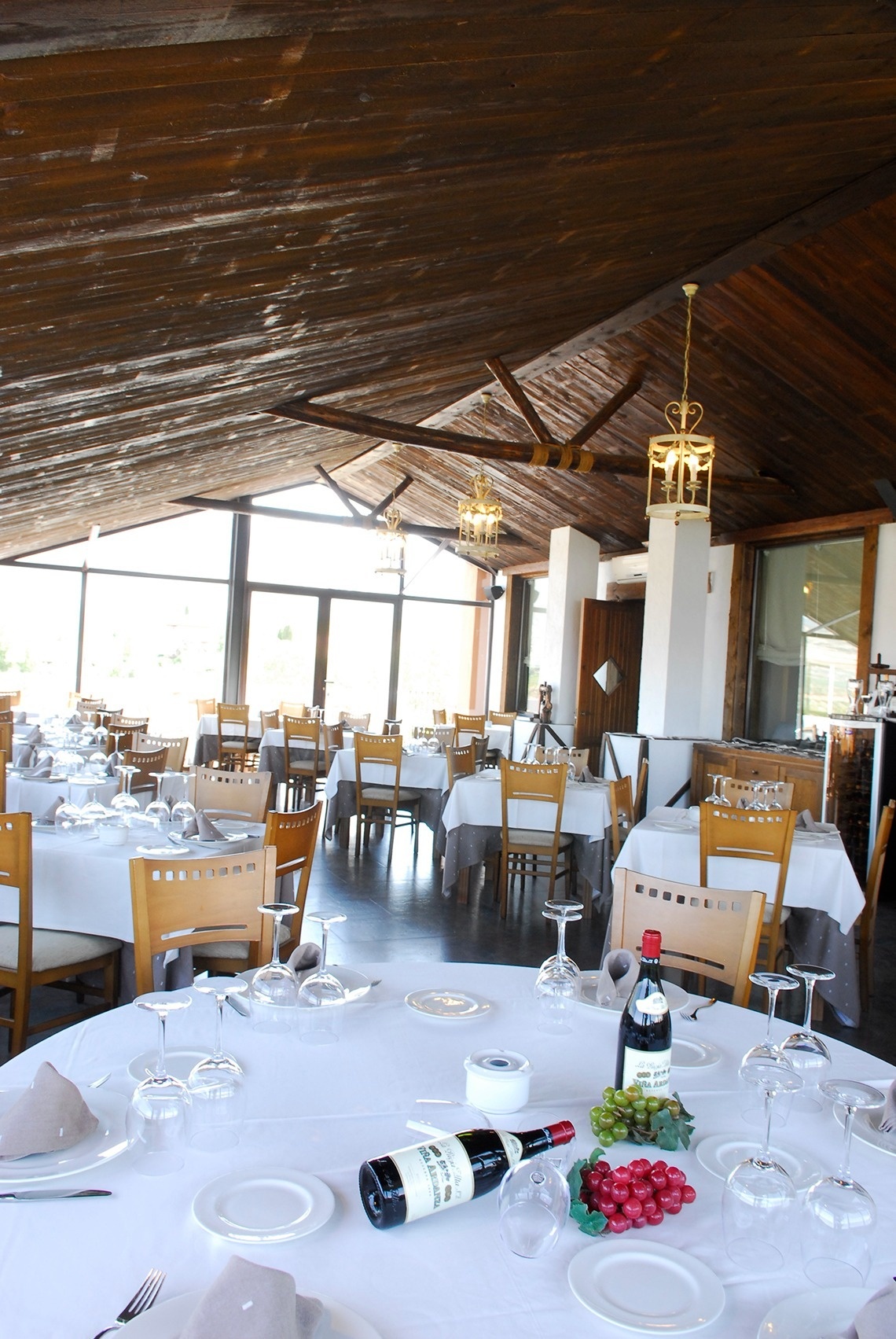 a bottle of wine sits on a table in a restaurant