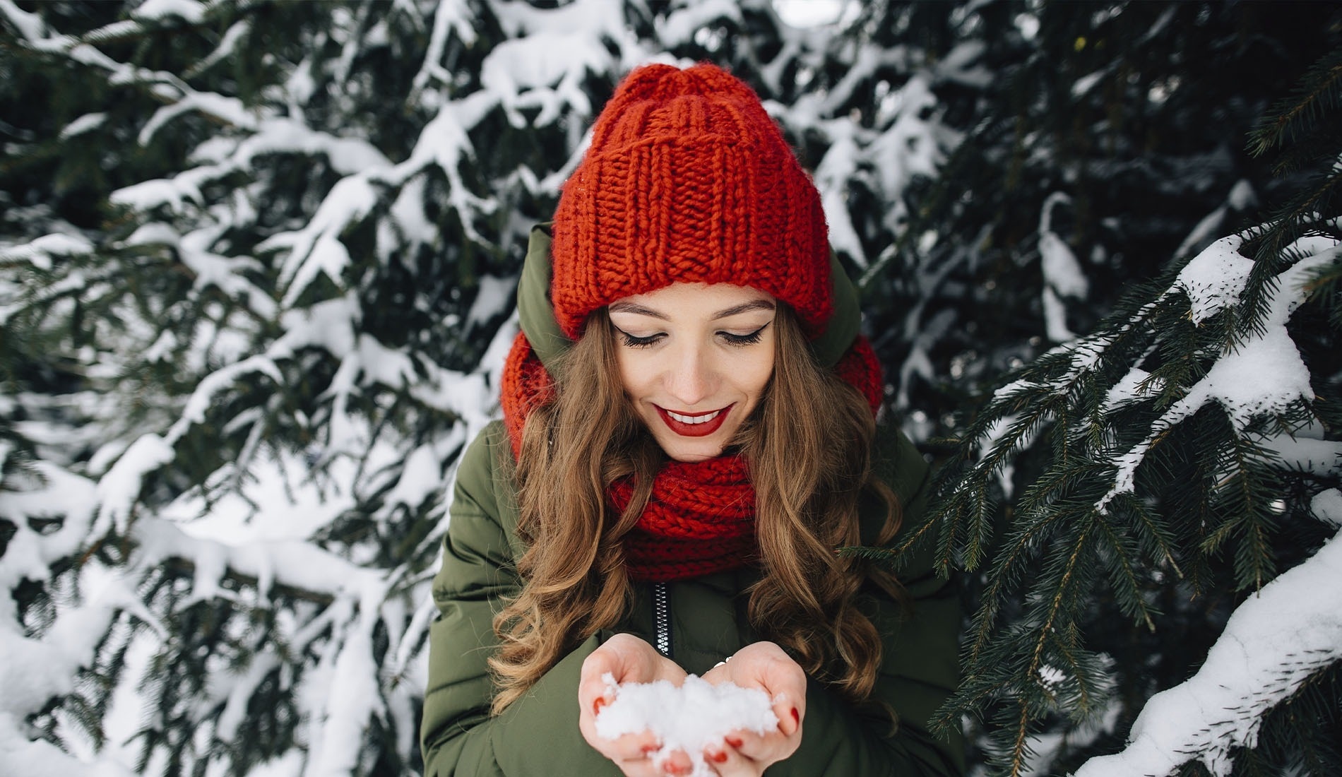 a large swimming pool surrounded by a white picket fence