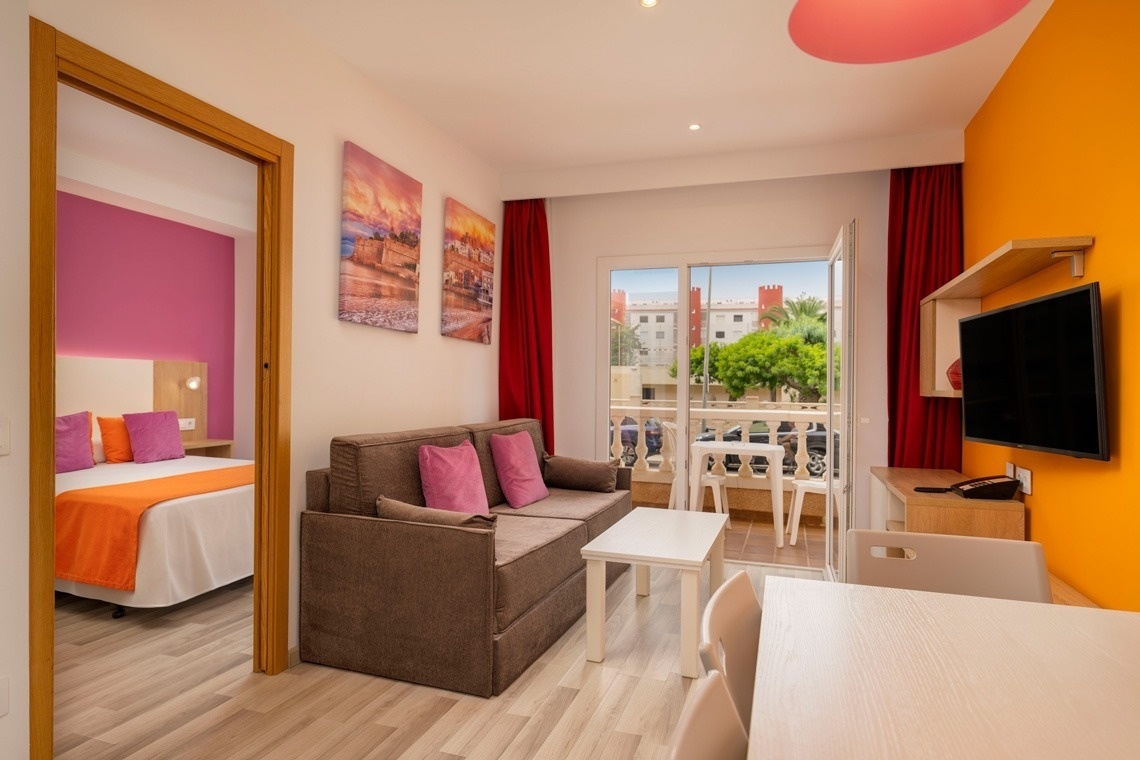 a living room with a couch and a flat screen tv